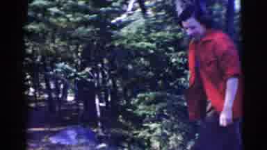 Miami Florida (1956): Happy Woman With A Red Jacket Walking Around A Fire Pit