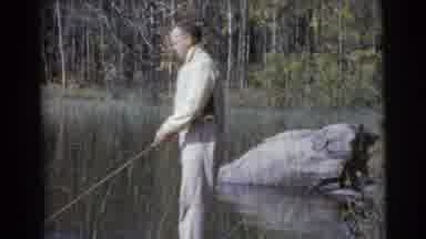 Miami Florida (1956): A Man Stands On A Rock While Fishing On A Lake