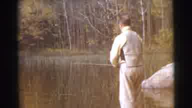 Miami Florida (1956): A Caucasian Older Man Fishes In A Tranquil Body Of Water