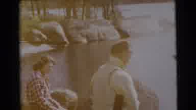Miami Florida (1956): Man Wearing Yellow Shirt Fishing By Lakeside On A Bright