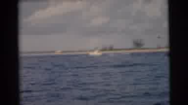 Miami Florida (1956): A Boat Going Along The Water On A Sunny Day