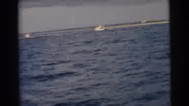 Miami Florida (1956): A View From Inside A Boat On The Water Looking At A Beach