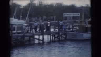Miami Florida (1956): View From The Water Of Men And Women Gathered On A Pier With