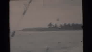 Miami Florida (1956): Two Men Standing On A Boat Moving Through A Waterway