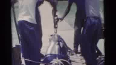 Miami Florida (1956): A Large Tuna Fish Is Unhooked And Laid On A Dock By A Group