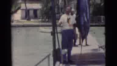 Miami Florida (1956): People Are Walking Back On A Pier Out To A Boat That Is