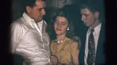New York City (1956): Man Wraps Arm Around Woman Who Appears To Want To Dance And