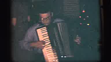 NEW YORK CITY-1956: Two Women Dance Together At A Party While A Man Plays The Accordion