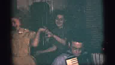 New York City (1956): Two Young Women Dance While Man Sitting In Chair Plays