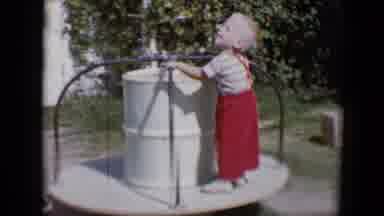 Tucson Arizona USA (1958): The Little Boy Has Blond Hair And Is Wearing Red Bib