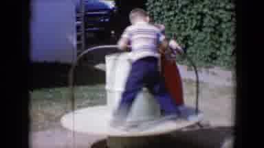 Tucson Arizona USA (1958): Two Little Kids Spinning Around On Merry Go Round