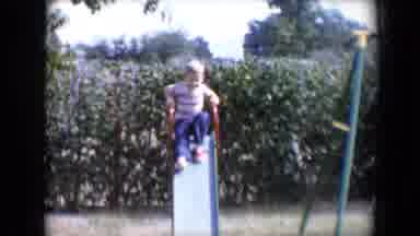 Tucson Arizona USA (1958): Child Continuously Going Up The Slide On A Sunny Day