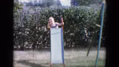 Tucson Arizona USA (1958): Two Children Playing On Slide Outside On A Sunny Day
