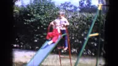 Tucson Arizona USA (1958): Toddler In Red Overalls And White Shirt Goes Down A