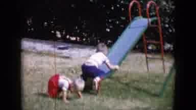 Tucson Arizona USA (1958): Two Children Playing Outside By Slide And Then On
