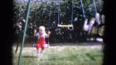 Tucson Arizona USA (1958): Two Very Small Children Swinging Outdoors In Their
