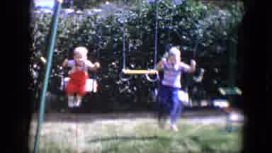 Tucson Arizona USA (1958): Two Boys On Swings In The Afternoon On A Summer Day