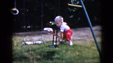 Tucson Arizona USA (1958): Two Small Boys Playing On Swing Set Outside