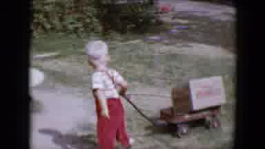 Tucson Arizona USA (1958): Vintage Young Boy Pulling Radio Flyer Wagon In The