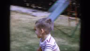 Tucson Arizona USA (1958): A Boy Riding A Bike In The Play Area At The Backyard Of