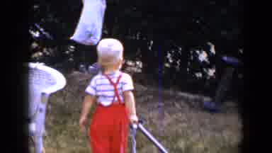 Tucson Arizona USA (1958): Blonde Toddler Boy Wearing Red Overalls Pulling His