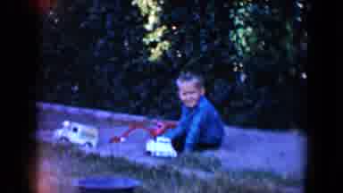 Tucson Arizona USA (1958): Little Boy And Girl Sit Outside On The Ground Smiling