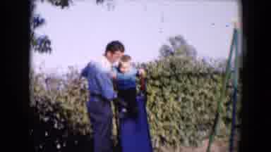 Tucson Arizona USA (1958): A Man Talking And Laughing With His Son On The Slide