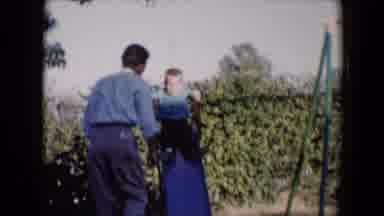 Tucson Arizona USA (1958): A Man With A Little Boy Sliding Down A Slide With