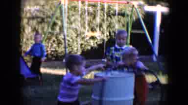 Tucson Arizona USA (1958): Two Children In A Merry Go Round With One Other One