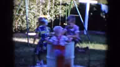 Tucson Arizona USA (1958): Young Children Play On Backyard Merry-Go-Round With