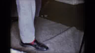 Tucson Arizona USA (1958): Man Picks Up Small Boy As The Other Boy Jumps Up Off Of