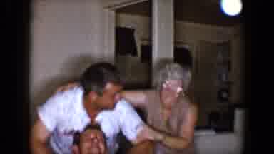 Tucson Arizona USA (1958): Woman Plays With Family Member In The Room Of Her