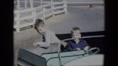 Tucson Arizona USA (1958): Boys Riding On A Mechanical Cart