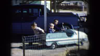Tucson Arizona USA (1958): A Little Kid Trying To Get A Small Car That Another Kid