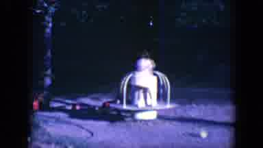 Tucson Arizona USA (1958): A Boy And A Girl Spinning Around Fast On A Merry Go