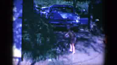 Tucson Arizona USA (1958): A Little Boy Driving A Red Cart Outside On A Sunny Day