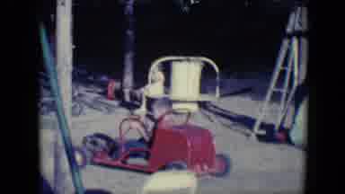 Tucson Arizona USA (1958): Young Boy Slowly Driving A Small Red Go Kart In Circles