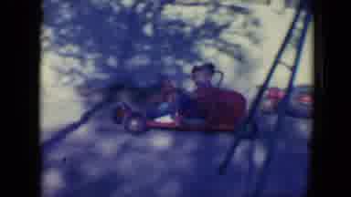 Tucson Arizona USA (1958): Two Little Boys Ride Around In Circles In A Little Red