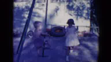 Tucson Arizona USA (1958): A Boy And Girl Playing On A Swing In Play Area