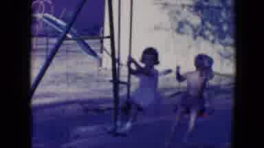 Tucson Arizona USA (1958): Two Small Children Playing On Swings,Dress, Bare
