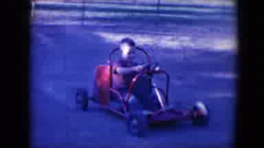 Tucson Arizona USA (1958): Young Boy Driving A Little Red Go Kart In Circles