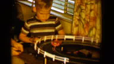 Tucson Arizona USA (1958): Two Boys Playing Racing Toy Cars On An Electronic Track