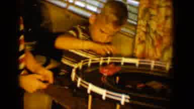 Tucson Arizona USA (1958): Boy Inside Playing With Toy Car Racetrack With Another