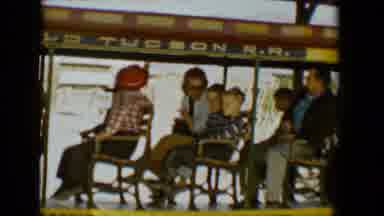 Tucson Arizona USA (1958): Multiple Kids Sitting On A Tram Talking Amongst Each