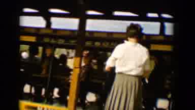 Tucson Arizona USA (1958): Group Of People Pass Other People On A Platform While