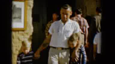 Tucson Arizona USA (1958): Man Walks With Arm Around One Son And Holding The Other