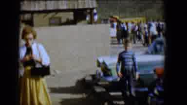 Tucson Arizona USA (1958): Boy And Woman Who Is Lighting Cigarette Walk Toward