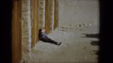 Tucson Arizona USA (1958): Little Boy Sits On The Ground Leaning Against The Wall