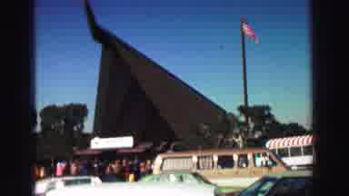 Lake Tahoe California (1969): A Crowd Of People Stand Outside An A-Frame Building
