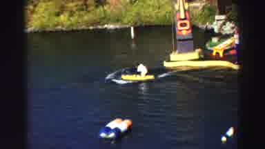 Lake Tahoe California (1969): Monkey In White Suit Rides A Watercraft Thru
